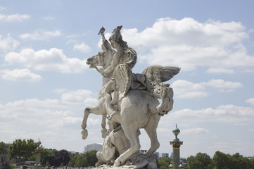 Ancient sculpture in Paris over the blue sky