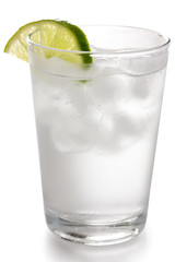 Detail of a glass of water with ice cubes and lime slice