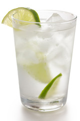Detail of a glass of water with ice cubes and lime slice