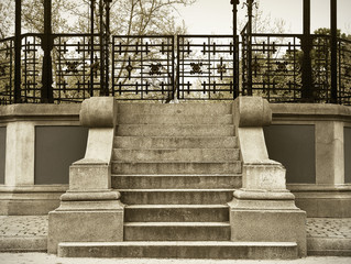 Antique stone stair with metallic fence in sepia tone © h368k742