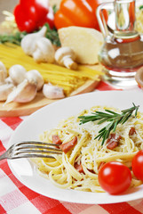 Pasta carbonara on the wooden table