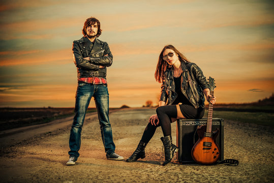 couple on a sunset road to horizon