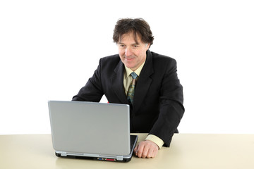 Business man sitting in front of his computer and working