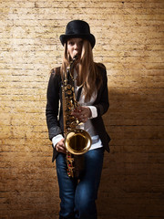 young beautiful woman with saxophone