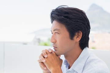 Fototapeta premium Thinking man with hands together