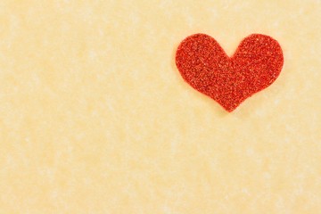 red heart on vintage parchment paper background