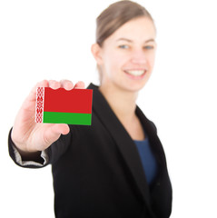 business woman holding a card with the flag of Belarus