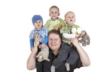 Father carrying his three children on shoulders
