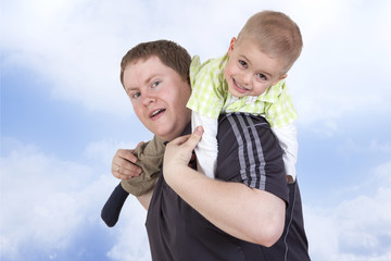 Father carrying his child on his shoulders