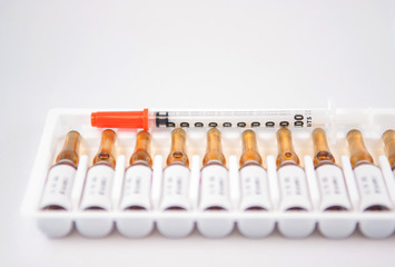 Disposable syringe on injection ampule pack