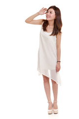 Naklejka premium Asian woman wearing white looking up