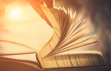 scrolling open book pages