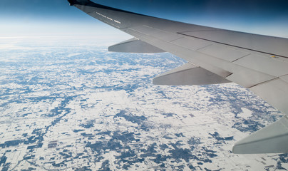 Obraz na płótnie Canvas Aerial view of snow covered landscape viewed from airplane, Mexi