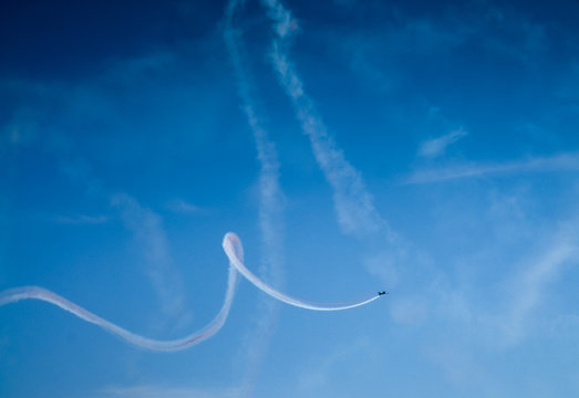 Low angle view of an airplane performing airshow