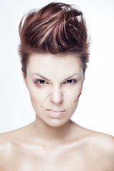 beautiful girl with a cut on face