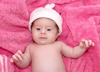 Beautiful baby girl on pink background