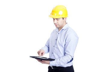 Handsome engineer working with a tablet pc, isolated on white