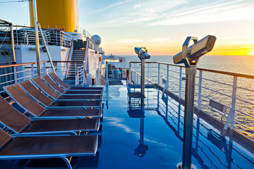 View of cruise ship deck, ocean and sunrise