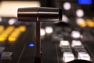 Wide shot of vision mixing panel in a television gallery.