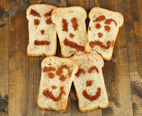 Funny toasts, on wooden background