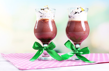 Tasty dessert with chocolate, cream and orange sauce,