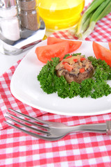 Stuffed mushrooms on plate on table close-up