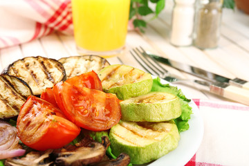 Delicious grilled vegetables on plate on table close-up
