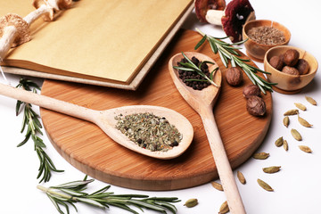 Different spices and cutting board, isolated on white