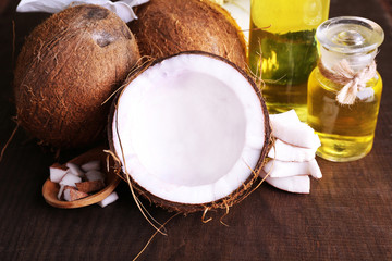 Coconuts and coconut oil on wooden table