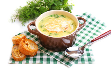 Tasty soup in saucepan, isolated on white