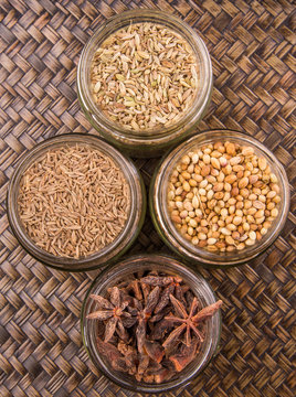 Spices and herb varieties over a wicker background 