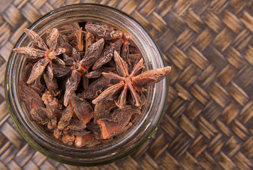 Star anise spice over a wicker background 
