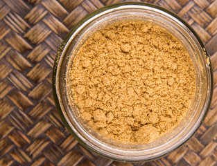 Korma powder spice over a wicker background 