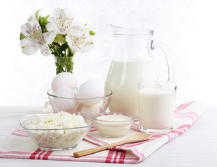 Tasty dairy products on wooden table