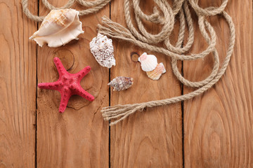 rope shells starfish on wooden boards