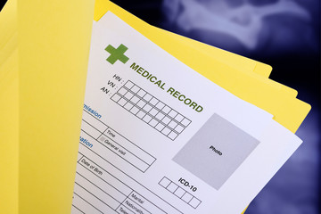 Blank medical record in yellow folder.