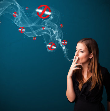 Young woman smoking dangerous cigarette with no smoking signs