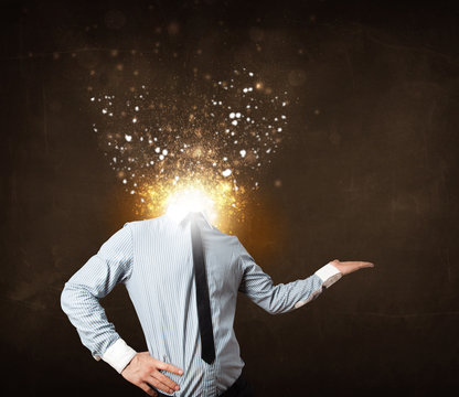 Business man with glowing exploding head