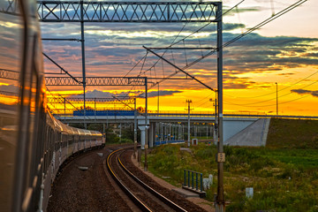 Naklejka premium Train at the sunset