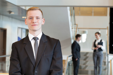 Man standing in business centre