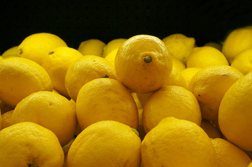 Colorful Display Of Lemons In Market