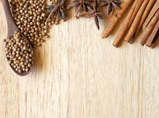 pepper seed and cinnamon on wooden table