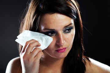 Hurt woman crying, smeared makeup