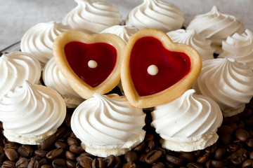 French vanilla meringue cookies and two sweet hearts