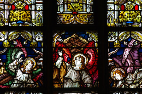 Three angels in stained glass