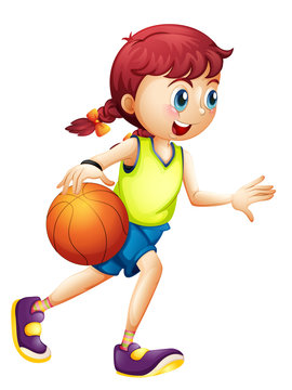 A young girl playing basketball
