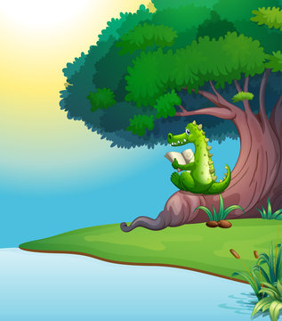 A crocodile reading under the tree