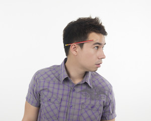 Fototapeta premium Man looking something and have a pencil side head.