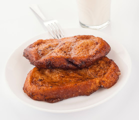 homemade French toast breakfast with glass of milk
