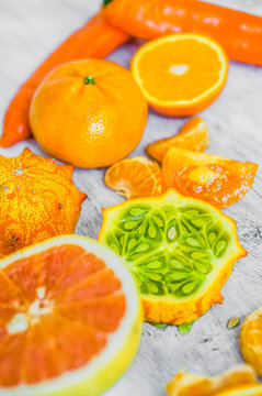 Orange fruits on rustic background